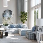Stylish living room with calming greys and beiges, thoughtfully added accent colors through decor.
