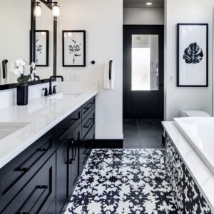 This charcoal and white lavatory featuring dual sinks and geometric tile backsplash