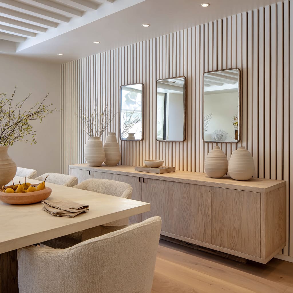 A Rounded Corner Mirror Trio on Vertical Wood Slat Wall in a Neutral Dining Room Design A Rounded Corner Mirror Trio on Vertical Wood Slat Wall in a Neutral Dining Room Design