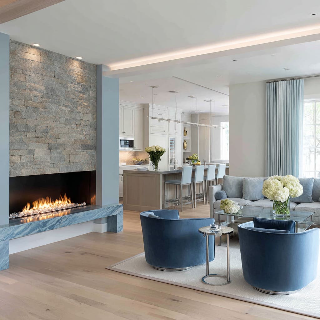 Coastal blue and silver living room inspo featuring stacked stone fireplace, blue stone bench, steel-blue chairs Coastal blue and silver living room inspo featuring stacked stone fireplace, blue stone bench, steel-blue chairs
