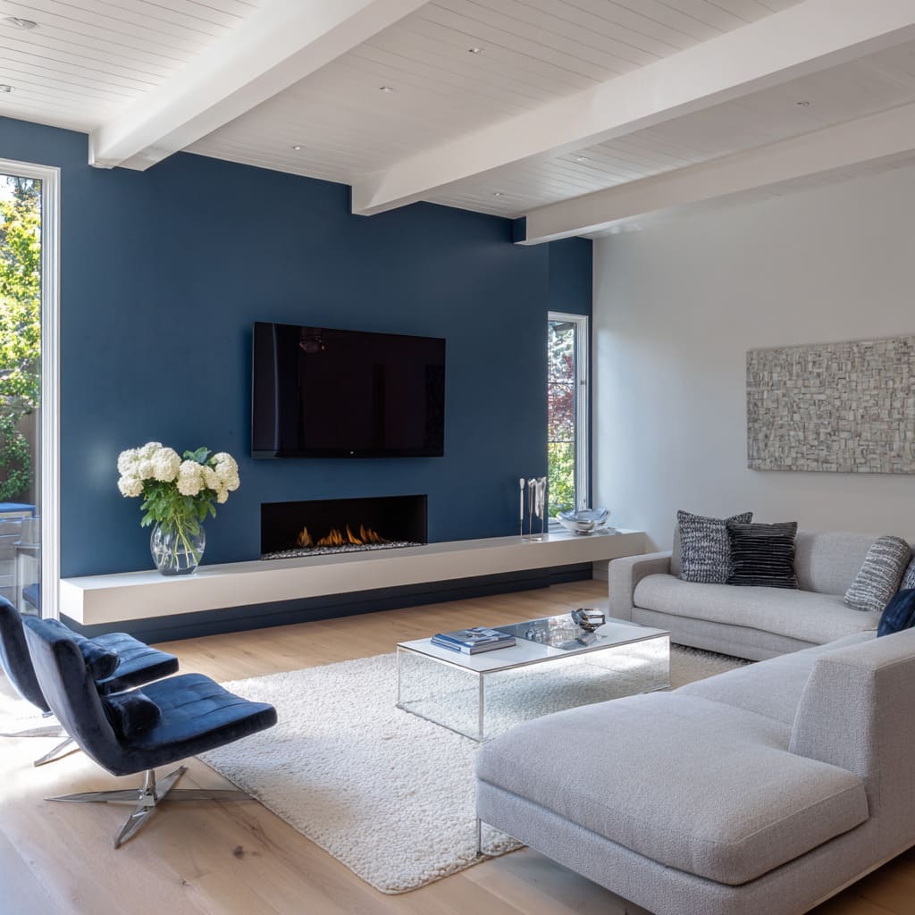 Modern living room concept with steel-blue accent wall, off-white sectional, mirrored coffee table, and silver elements Modern living room concept with steel-blue accent wall, off-white sectional, mirrored coffee table, and silver elements