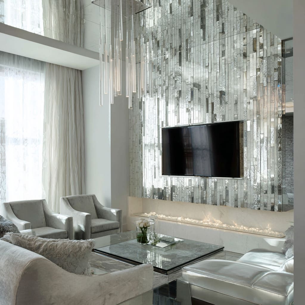 Small elegant silver-grey living room idea with mirrored mosaic wall Small elegant silver-grey living room idea with mirrored mosaic wall