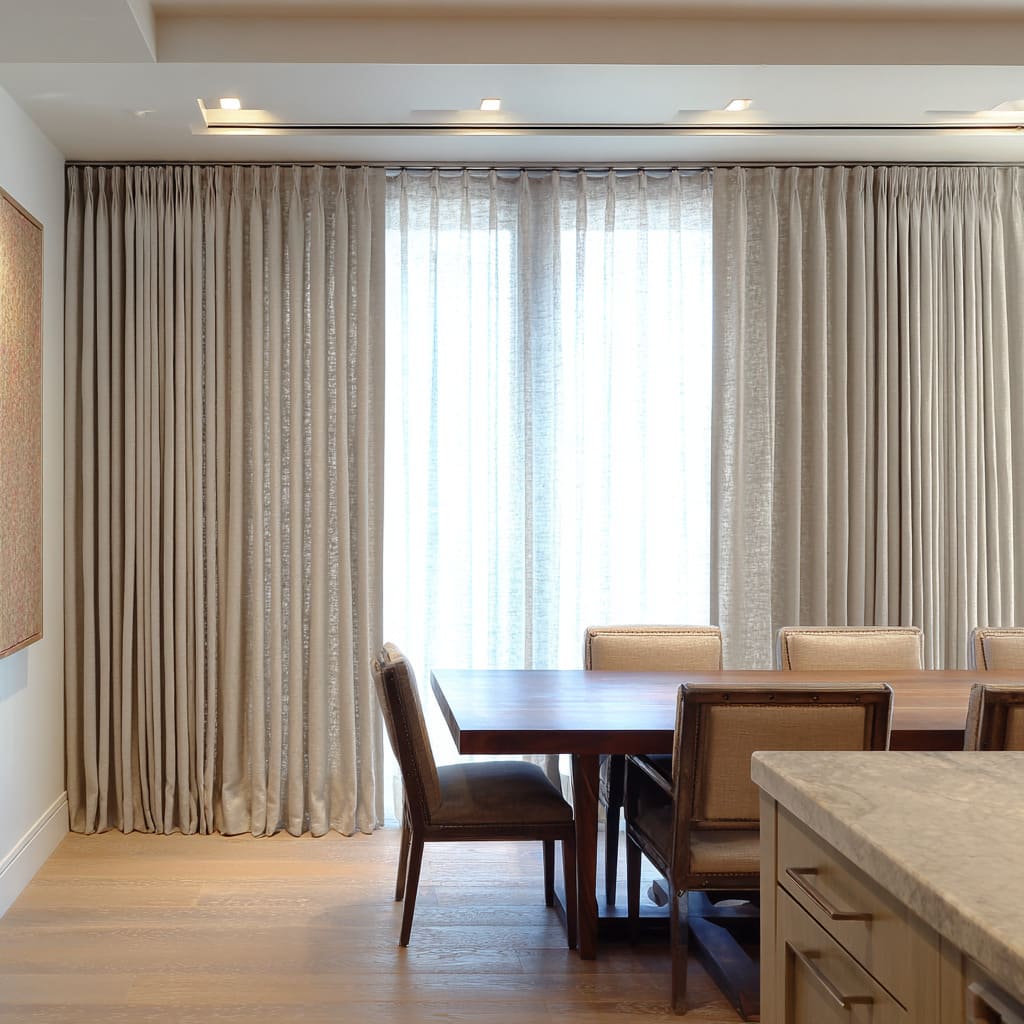 Full-wall drapery plus center sheer creating a soft backdrop Full-wall drapery plus center sheer creating a soft backdrop