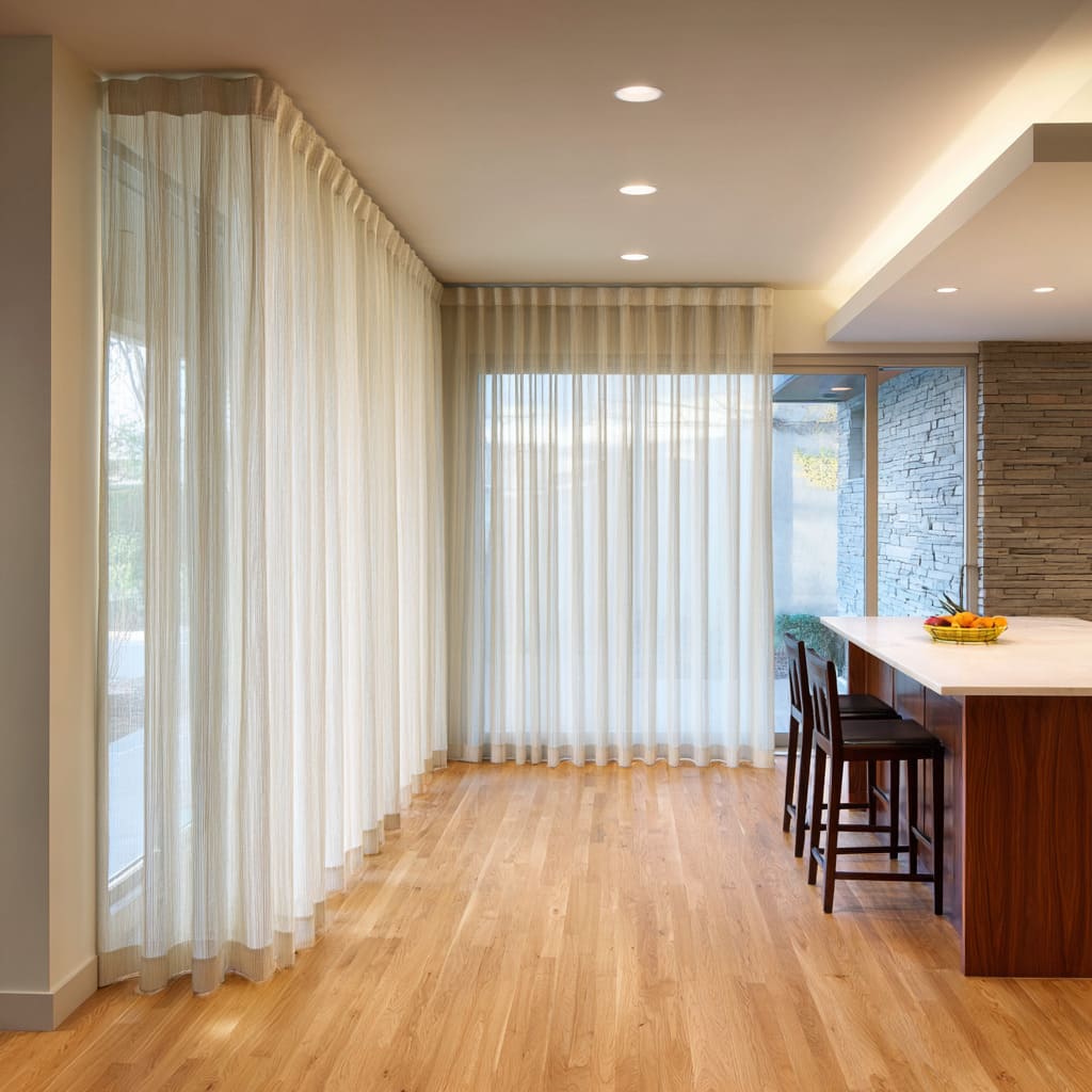 Wraparound sheers forming an L-shaped soft corridor by glazing Wraparound sheers forming an L-shaped soft corridor by glazing