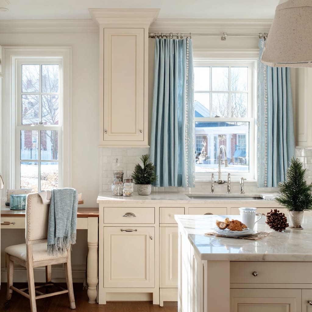 blue curtains with white pom-pom snowball trim frame a cream kitchen window decorated with small evergreens, glass jars blue curtains with white pom-pom snowball trim frame a cream kitchen window decorated with small evergreens, glass jars