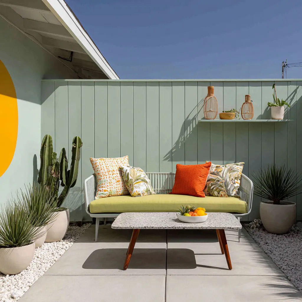 One bold painted shape on a calm fence and a tiny shelf vignette that feels like a modern signature. One bold painted shape on a calm fence and a tiny shelf vignette that feels like a modern signature.